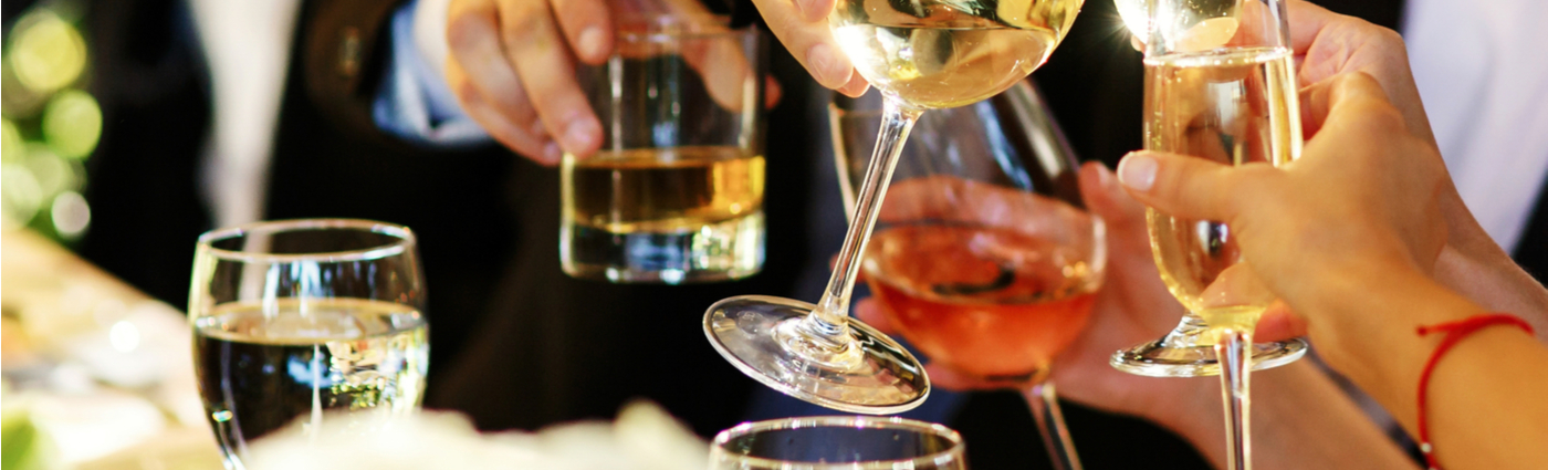 Guests raising glasses at a celebration